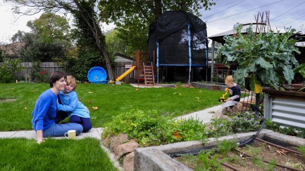 Suzanne Pippen with her children Hannah, 4, and Dominic, 2, in their Duffy back yard, worried about being built out by dual occupancies that will be allowed on Fluffy blocks.