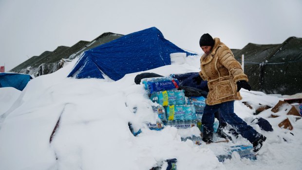 Snow is thick on the ground at the protest camp. Mountains of donated food and water were being stockpiled.