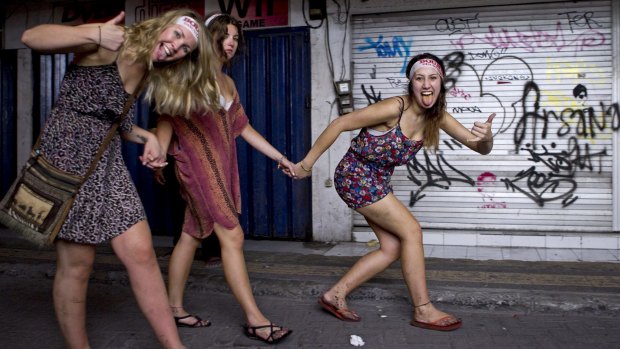 School leavers heading home through the back streets of Kuta after a big night of partying.