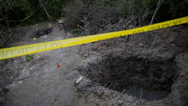 Grave site: The bodies of 28 people, believed to be students, have been found near Iguala.