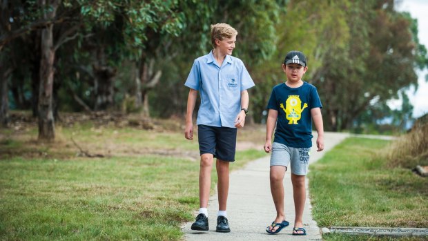 Jordan King (left) helped Alvin Zhao (right) track down his parents after he became lost five kilometres from home. 