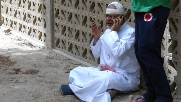 A man at the site of a suicide bombing at a mosque in Kuwait City.