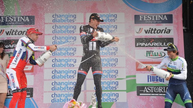 John Degenkolb, centre, celebrates his Milan-San Remo win with second-placed Alexander Kristoff and third-placed Australian Michael Matthews, right.