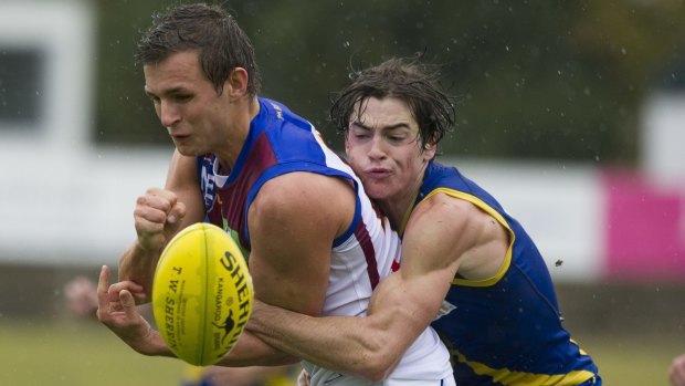 Canberra Demons' Jordan Harper fights for the ball.