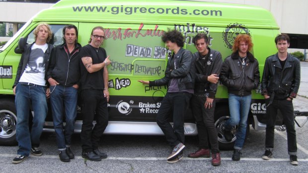 The 2005 USA OR BUST tour party in South Carolina with the van provided by Gig Records before the last gig of the tour. From left,Mat de Koning (director, Meal Tickets), Dave Kavanagh (then manager of the Screwtop Detonators), Pip McMullen (tour manager), with band members Charlie Austen, Lee French, Ben Ward, Mitch Long.