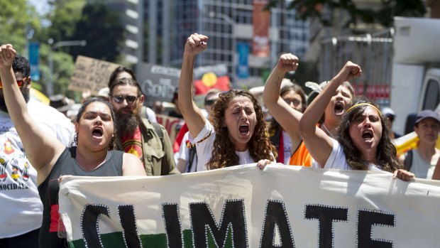Demonstrators protest in Brisbane over climate change   ahead of the G20.