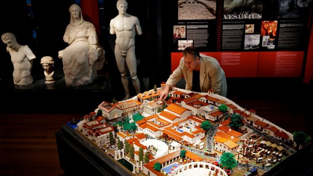 Hoping to draw high school students: University of Sydney's Dr Craig Baker with Lego Pompeii.