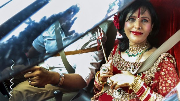 India's self-styled incarnation of the Hindu goddess Durga, Radhe Maa, leaves the Kandivali police station in Mumbai after questioning in August.