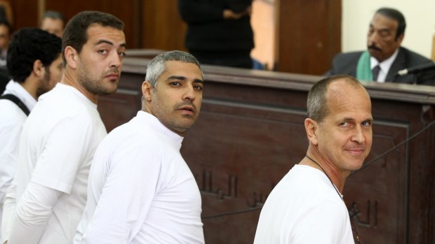 Al-Jazeera producer Baher Mohamed, left, Canadian-Egyptian bureau chief Mohammed Fahmy, centre, and Peter Greste in March 2014. 