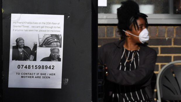 A missing person poster is displayed near the tower block.