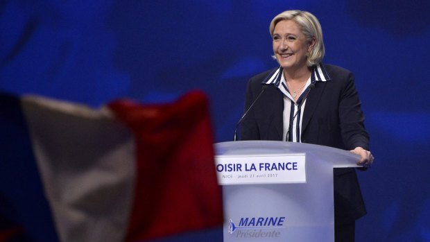 Presidential Candidate Marine Le Pen addresses voters during a political meeting on April 27 in Nice, She resigned from the leadership of the National Front to represent "all French".