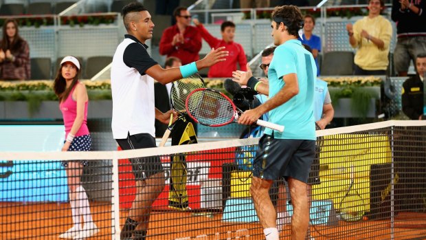 Kyrgios and Federer shake hands after the Canberran's three set victory.