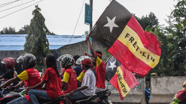 Supporters of Fretilin, the country's largest political party, on the streets of Dili.