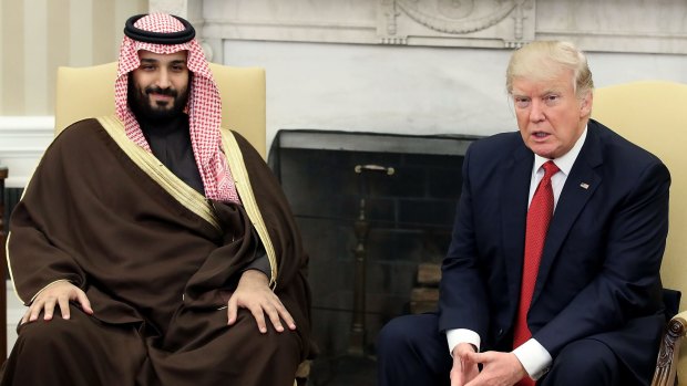 President Donald Trump, speaks with Mohammed bin Salman at the White House. 