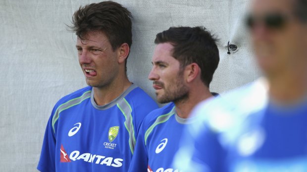Vying for a position: James Pattinson and Chadd Sayers look on during Australia's nets session.
