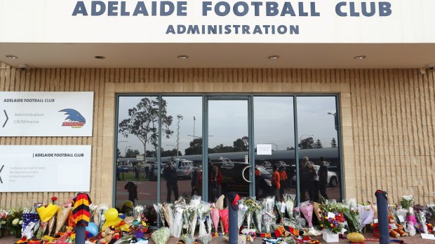Tributes to the late Adelaide coach outside AAMI stadium.