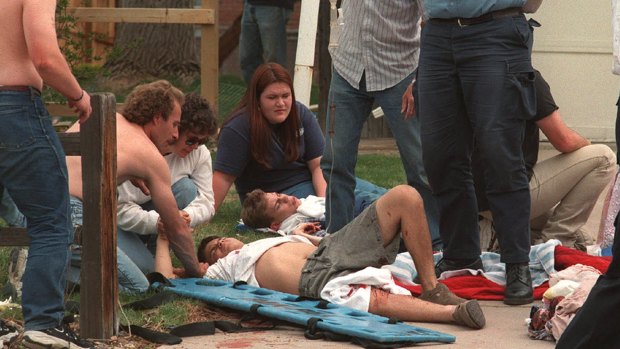 Rescuers tend to the wounded at a triage area near Columbine High School in Colorado in 1999.