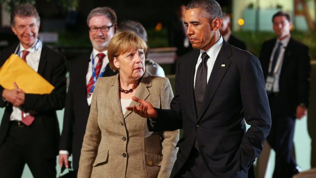 US President Barack Obama and German Chancellor Angela Merkel arrive at the Gallery of Modern Art on Saturday night.