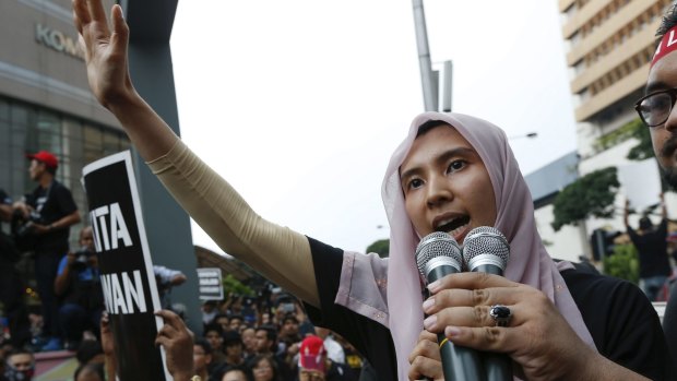 MP and vice-president of the People's Justice Party Nurul Izzah Anwar speaks to protesters as they gather to demand the release of her father, Anwar Ibrahim, last year.