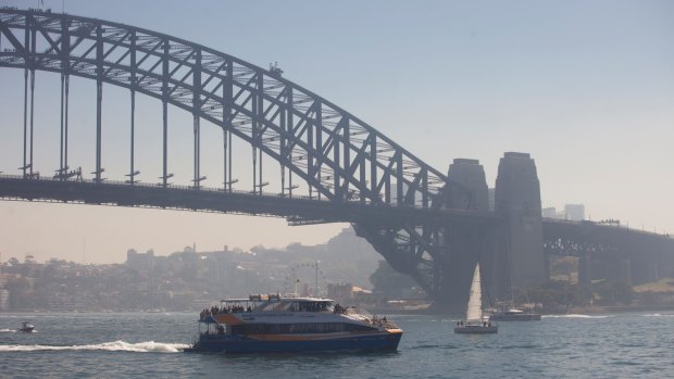 Sydney Harbour cloaked in a smoke haze from hazard reduction burns.