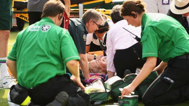 Bethanie Mattek-Sands receives treatment from the medical team after taking a horrific fall. 