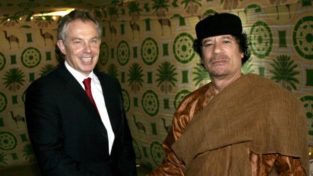 Former British prime minister Tony Blair, left, meets then Libyan leader Muammar Gaddafi, at his desert base near Tripoli in 2007. 