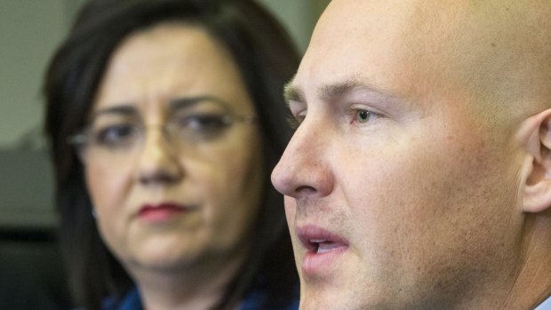 Queensland Premier Annastacia Palaszczuk looks on as Treasurer Curtis Pitt talks about his first budget.