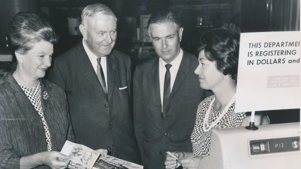 A smooth transition: Miss N. Malseed (in charge of decimal training at Myer), Sir Walter Scott, Mr L. B. Brand and Mrs J. Smith, Myer staff member. 