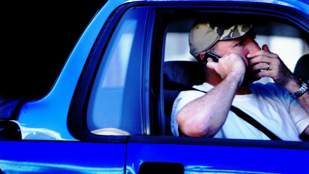 More than 80 people were caught texting or calling while on the road during Day 1 of the holiday road toll period.