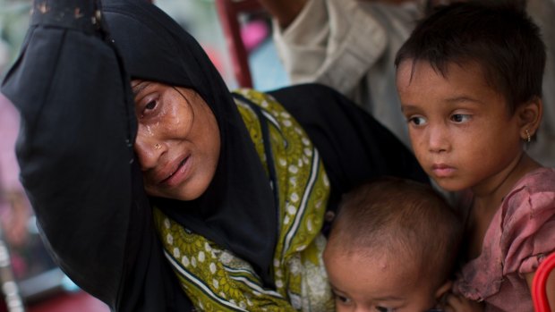 An exhausted Rohingya mother arrives at Kutupalong refugee camp earlier this week.