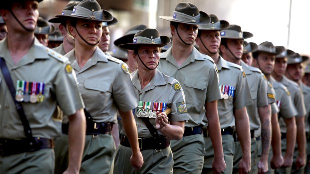 Service men and women march in the Anzac Day Parade.