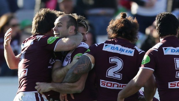 Brett Stewart of the Sea Eagles celebrates scoring the match winning try with team mates during the round 23 NRL match between the Canberra Raiders and the Manly Warringah Sea Eagles.
