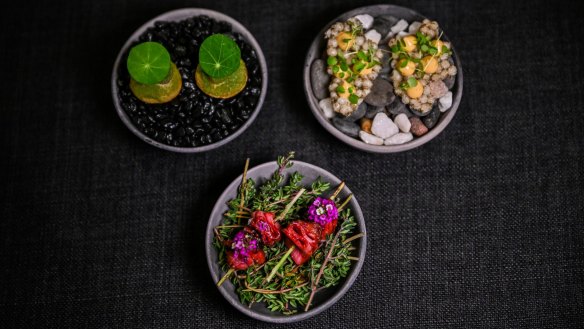 Opening snacks may include skewered ox tongue with lilly pilly (front).