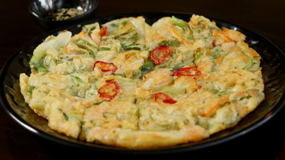 Seafood pancake with prawns and vegetables.
