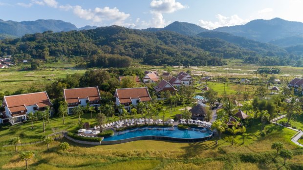 The semi-detached villas at the Pullman Luang Prabang, in Laos, are spread among working rice paddies.