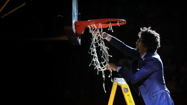 End of an era: Josh Childress cuts down the nets at the Kingdome.