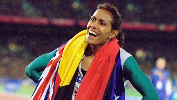 Cathy Freeman celebrates winning gold at the Sydney Olympics in 2000.