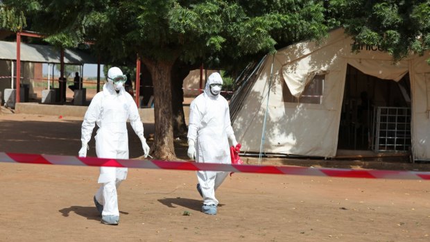 Suited up: Health workers at an Ebola treatment centre in Mali.