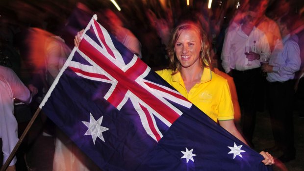 Flag bearer: Sharelle McMahon leads the Australians in Delhi.