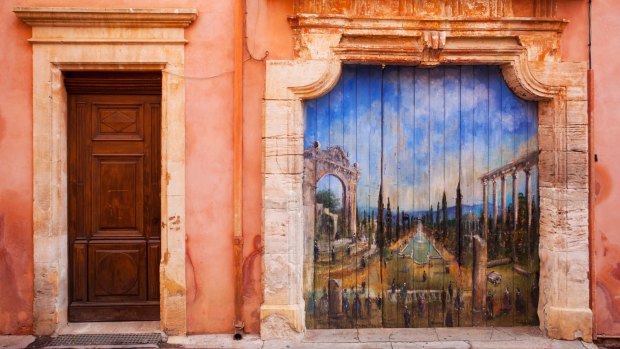 An ochre red pigment permeates both the town's handsome buildings and the cliffs on which they're nestled in Roussillon, Provence. 