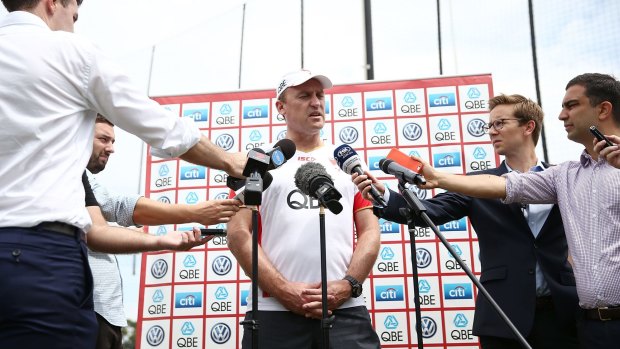 Swans coach John Longmire talks to media at a  pre-season training session.