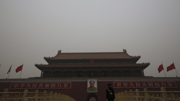 The Tiananmen Gate, where the portrait of China's late Chairman Mao Zedong is displayed is seen on a polluted day, in Beijing in January.
