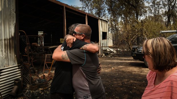 Kevin Nightingale is hugged by a relative.