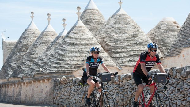 Pedalling past the iconic trulli of Puglia - ancient pointy-roofed, conical-shaped stone huts dotted in and around Alberobello.