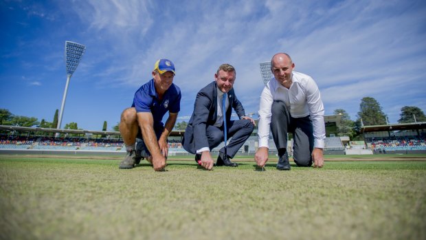 Cameron French (right, with curator Brad Van Dam and the ACT government's Jeff House) says the Manuka Oval pitch has received good feedback from Cricket Australia.