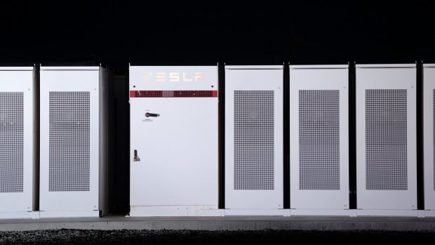 Tesla Powerpacks that were used to form the world's largest lithium-ion battery stand on display at the Hornsdale wind farm near Jamestown, South Australia.