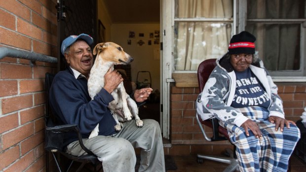 Waterloo public housing resident Walter Murray with Rose Dodson and Mr Murray's dog Scrappydoo. Mr Murray has greeted the plans with suspicion.