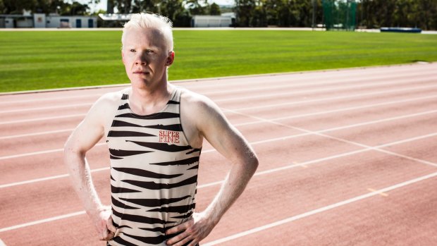 Sprinter Chad Perris says albinism has not stopped him from training outside in the scorching summer heat.