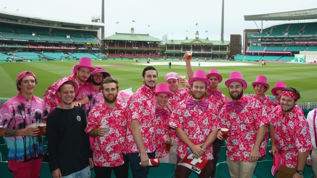 Members of the crowd dressed in pink for Jane McGrath Day pose as they wait for play to start on day three of the third Test match between Australia and the West Indies at Sydney Cricket Ground. 