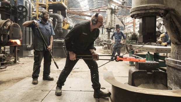 Craftsmen: Anthony Potts watches blacksmith Guido Gouverneur. 